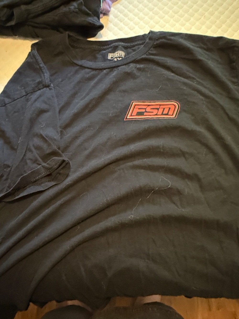 Source Unknown Black Short-Sleeve Tee with Red FSM Logo